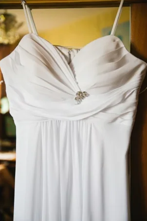 Wedding dress hanging up ready to wear