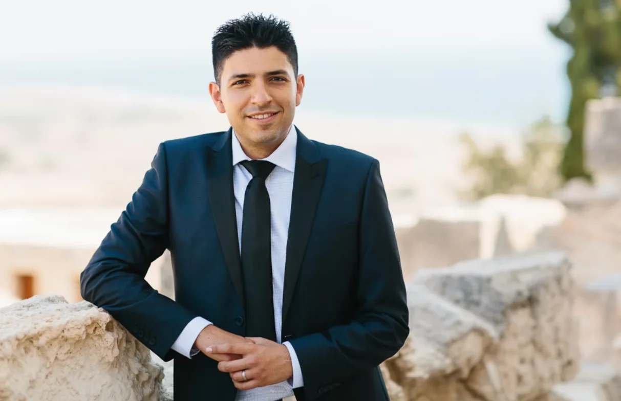 Portrait of man in a dark suit and tie