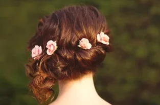 Brides hair from the back with flowers in her hair