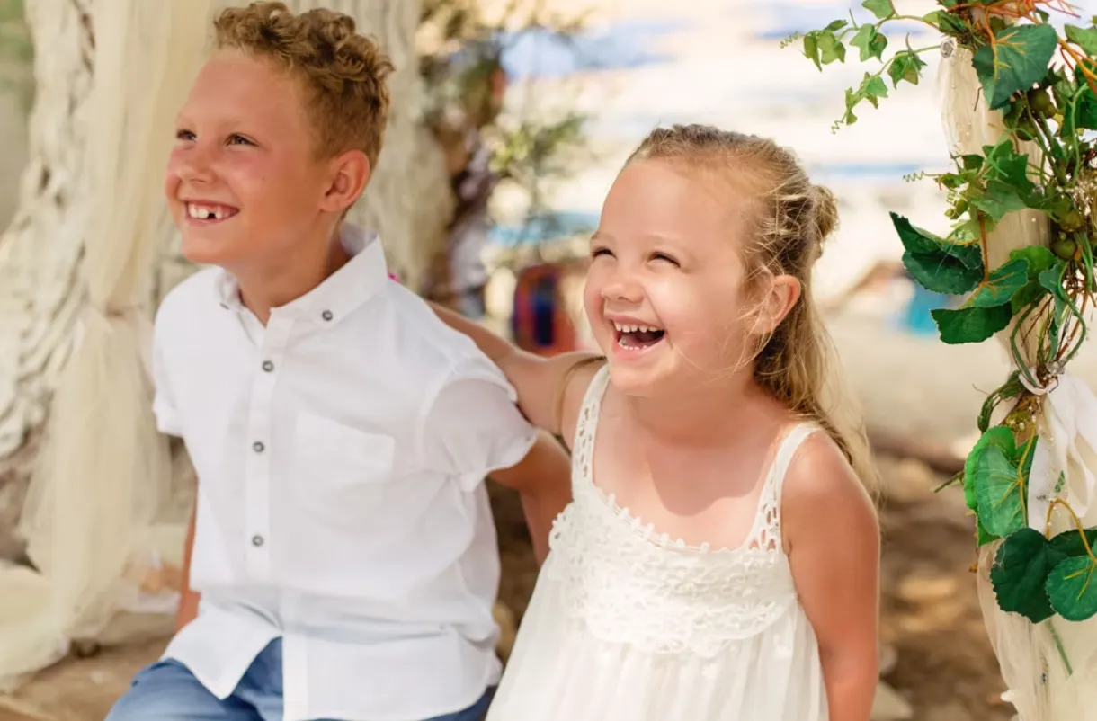 Young wedding guests smiling and laughing together